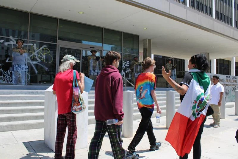 Peaceful protesters in Los Angeles confront National Guard